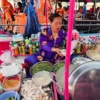 Seller cooking food on the boat