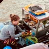 The seller on the boat at Cai Rang Floating Market