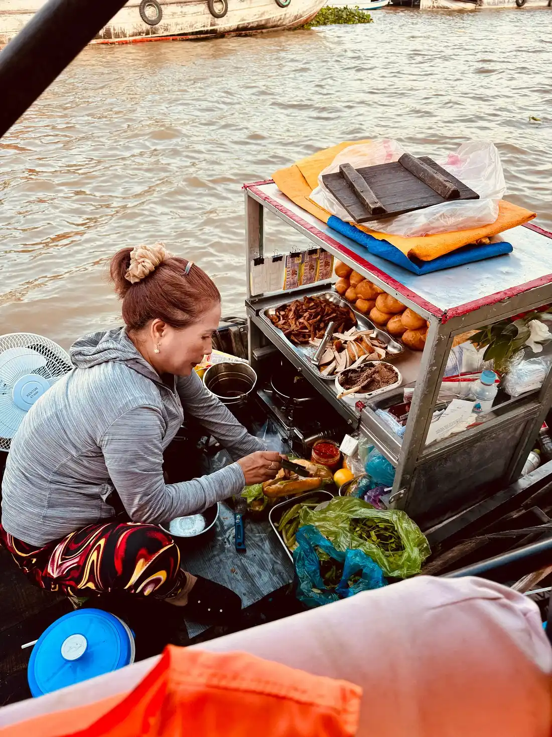 The seller on the boat at Cai Rang Floating Market