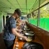 Trying make the rice noodle pizza with local people