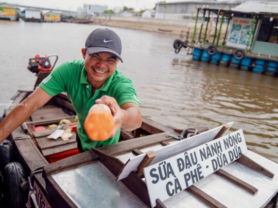 A close-up shot of a friendly local's face on can tho city tour