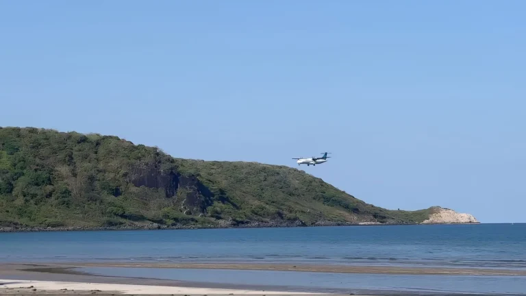 Airplane flying above Vong Beach in Con Dao before the Bamboo Lagoon forest hike
