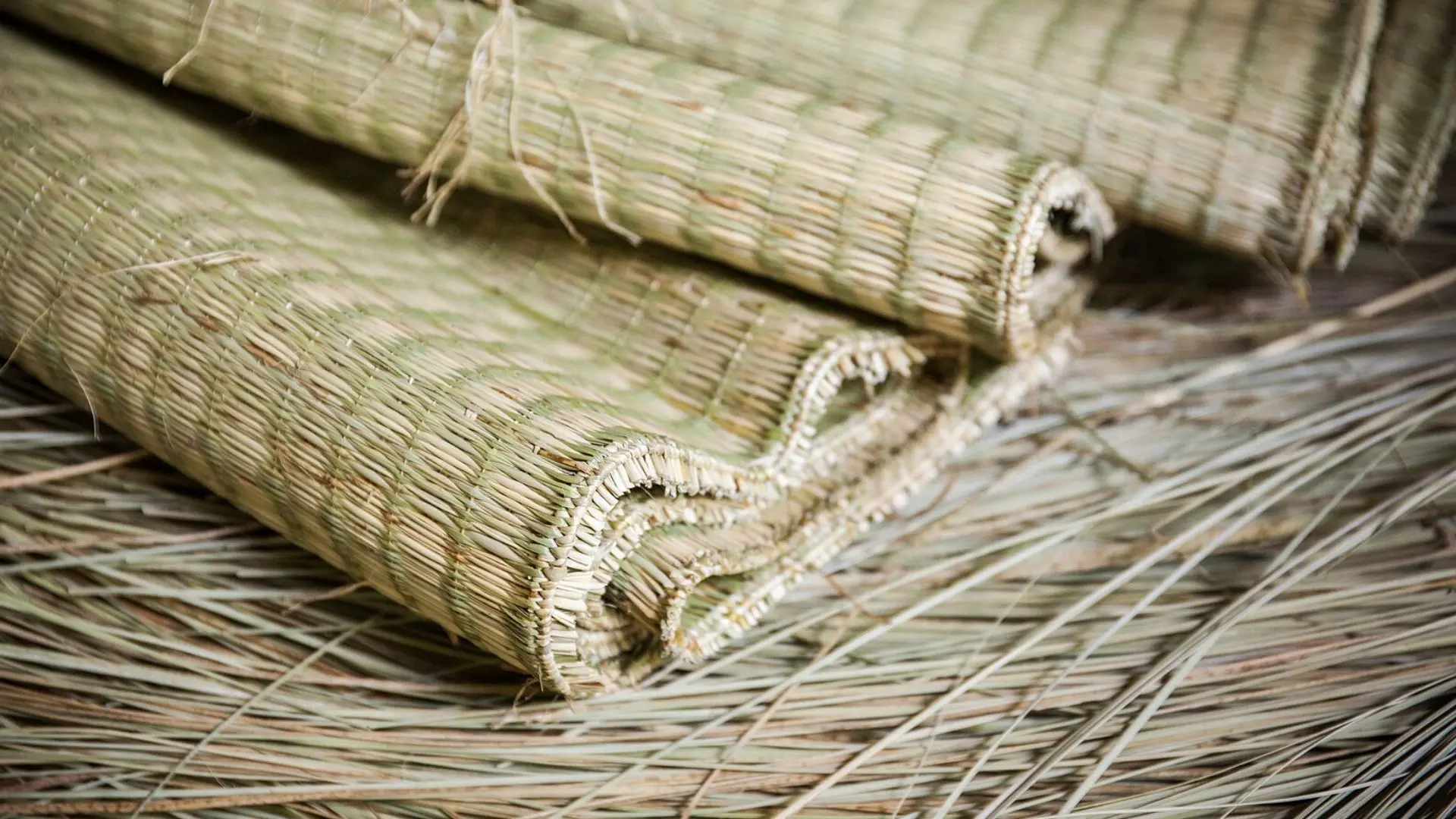 An Hiep Mat Weaving Village: A Hidden Craft Village in Ben Tre 159 Stacked rolls of finished traditional sedge mats at An Hiep Mat Weaving Village