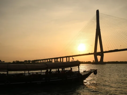 Approaching Can Tho Bridge during a peaceful sunset cruise – Can Tho Sunset Tour by Mekong Smile
