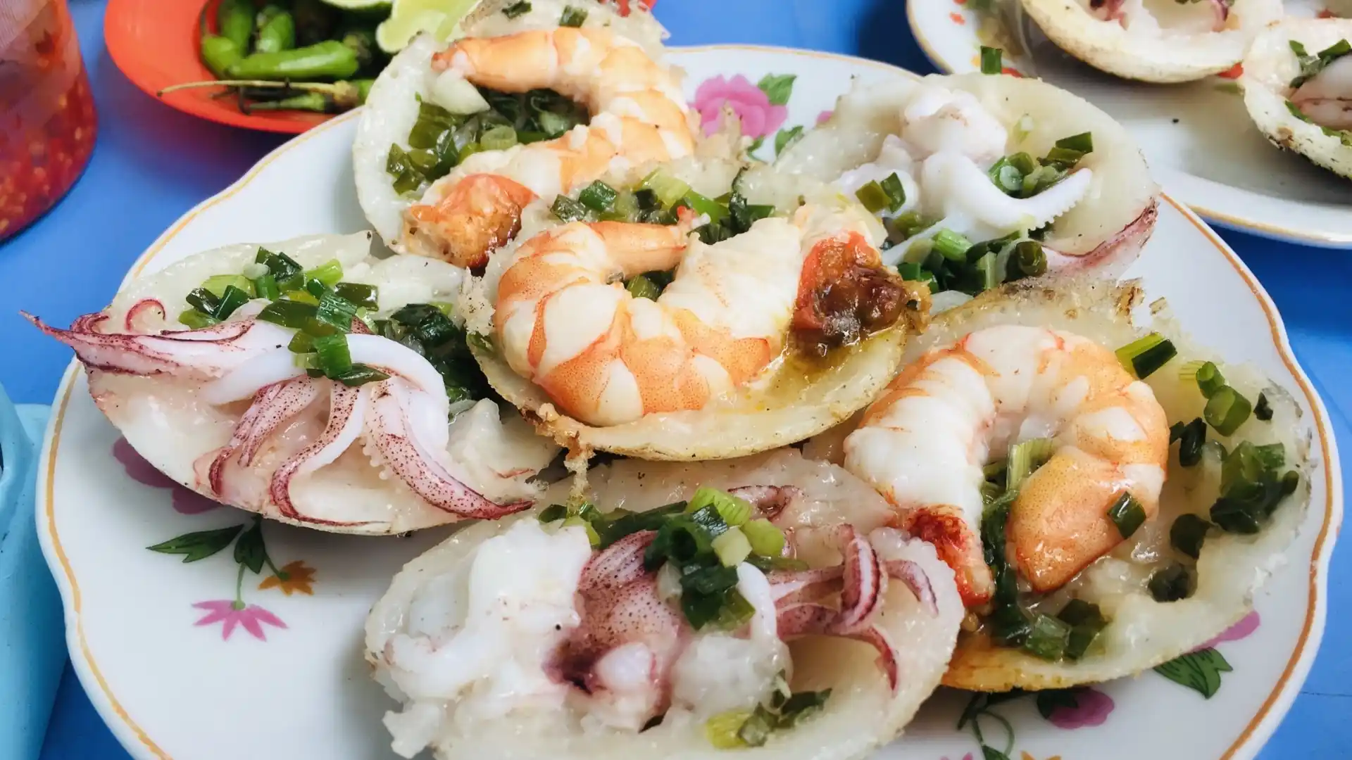 What to Eat in Vietnam: 30 Must-Try Dishes 92 Small bánh căn rice cakes topped with seafood and scallions