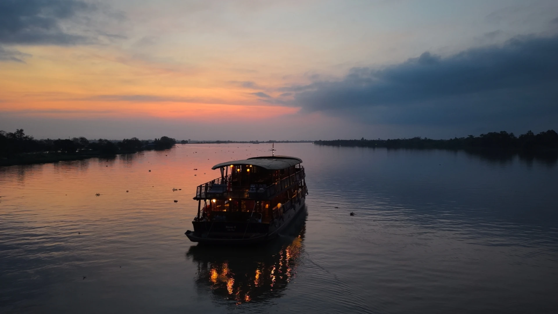 Bassac Cruise Mekong Delta traditional wooden boat on the river