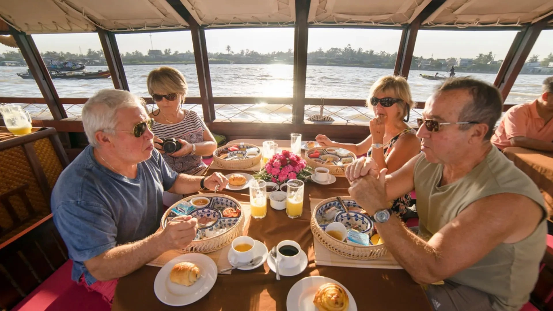 Bassac Cruise Mekong Delta guests enjoying breakfast at Cai Rang Floating Market