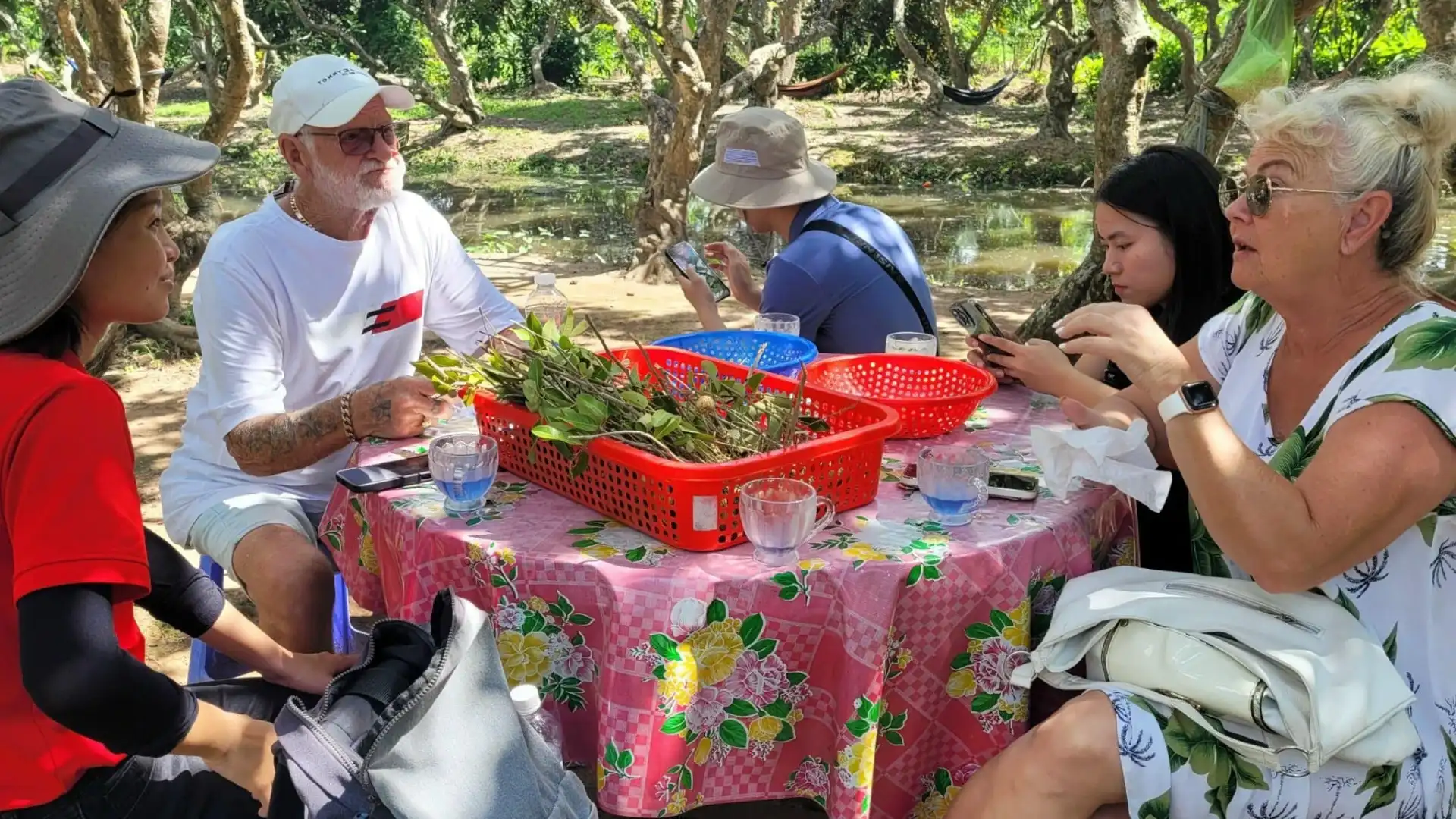 Bassac Cruise Mekong Delta guests enjoying fresh tropical fruits