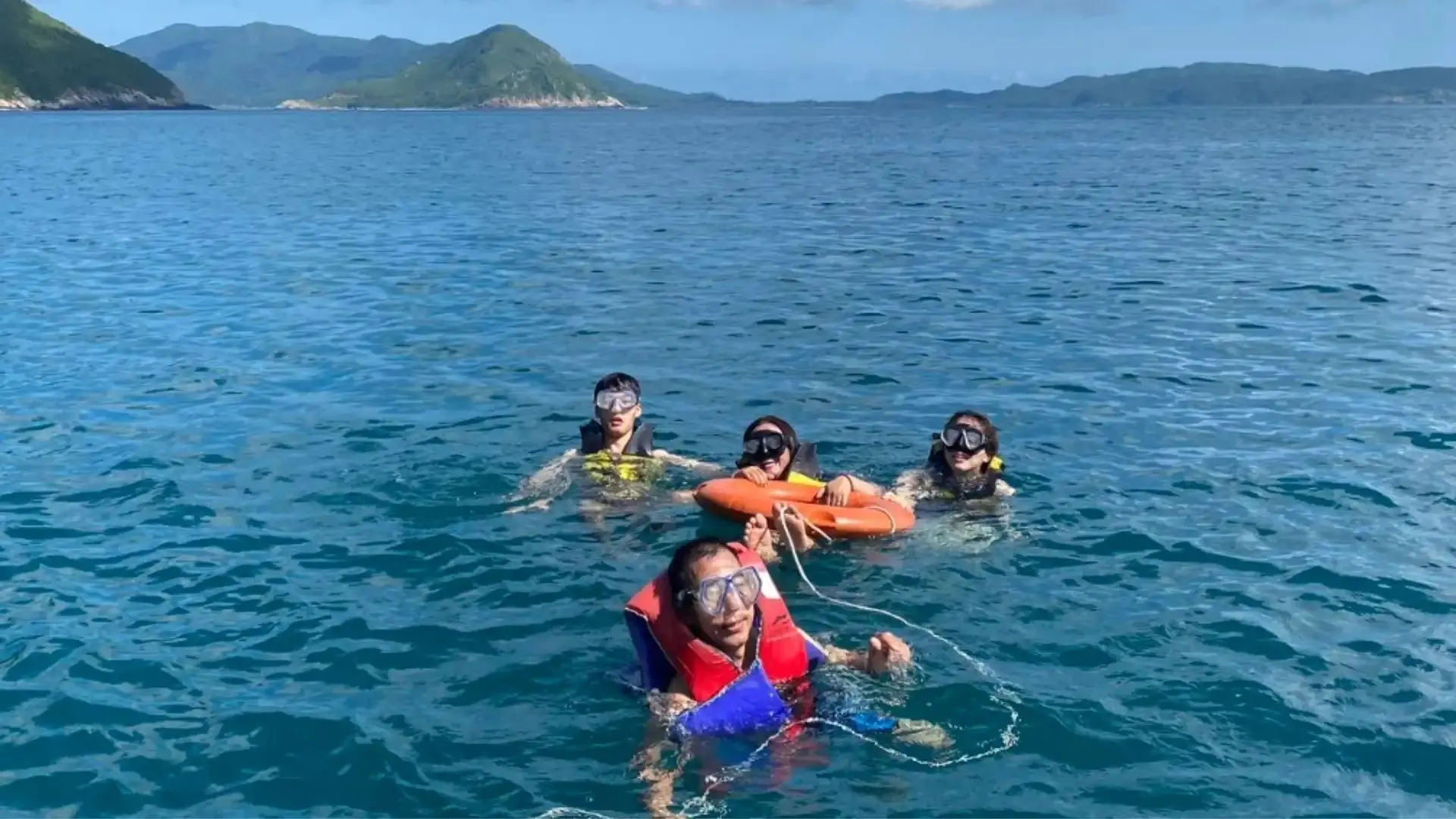 Con Dao Reef Experiences: Giant Clams, Coral Reefs and Island Sea Routes 11 Travelers snorkeling near Bay Canh and Cau Island in Con Dao