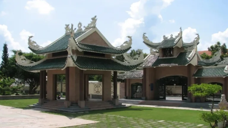 Traditional pavilions with green-tiled roofs within Bui Huu Nghia Memorial