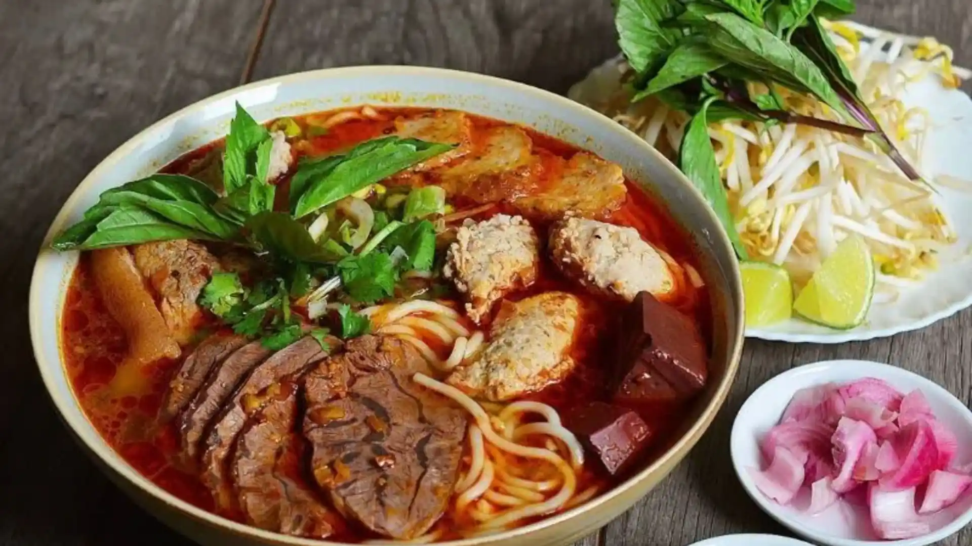 What to Eat in Vietnam: 30 Must-Try Dishes 85 Bún bò Huế with thick rice noodles, beef and red broth