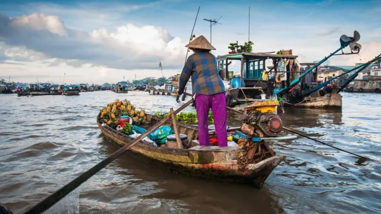 Local fruit boat at Cai Rang Floating Market in Can Tho