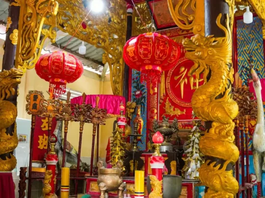 Traditional Vietnamese decorations inside a temple, showcasing intricate cultural details and designs.