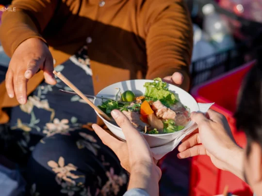A delicious bowl of Hu Tieu, a traditional Vietnamese noodle soup on Cai Rang floating market tour