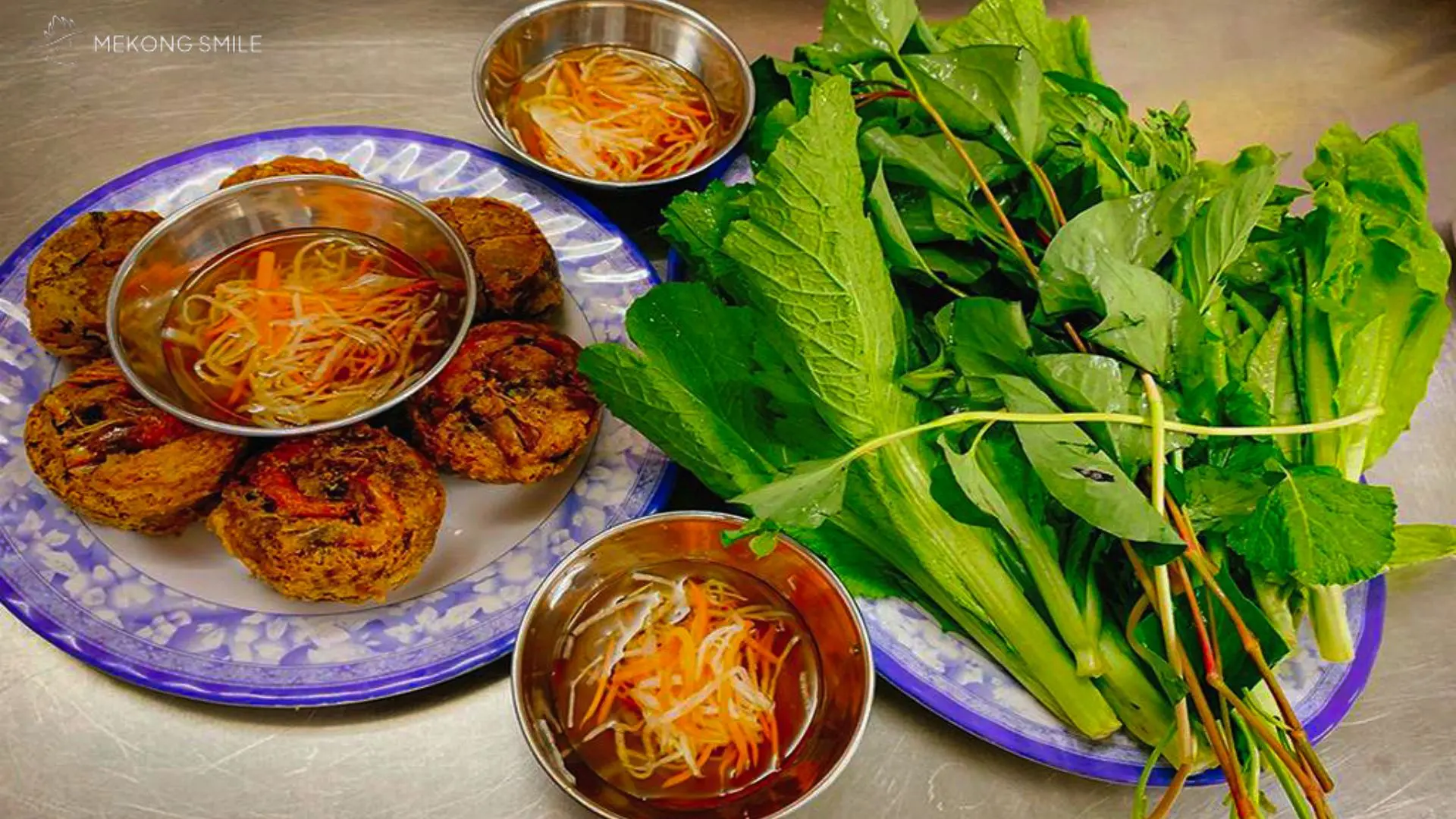 A platter of Bánh Cống (shrimp and pork cake), a crispy and savory specialty of the Mekong Delta