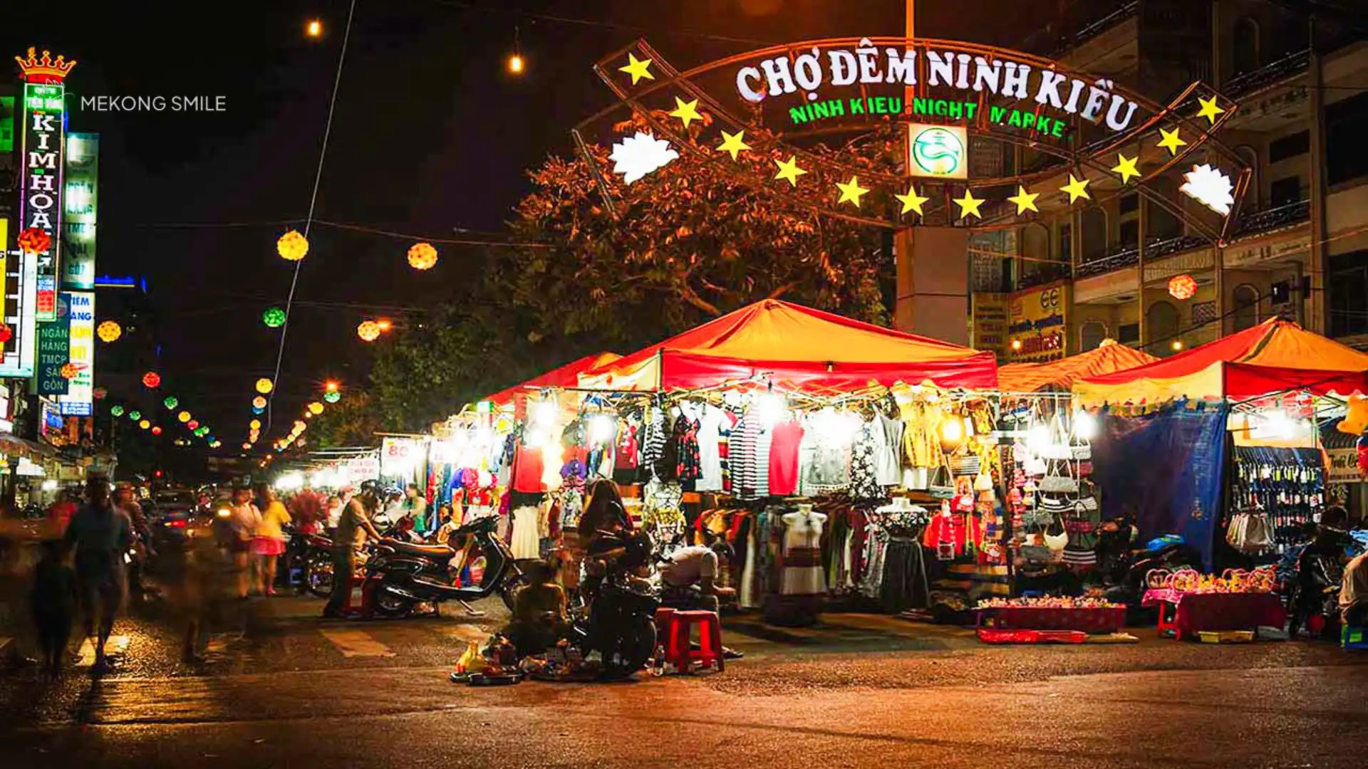 A shot capturing the vibrant lights and lively atmosphere of the Ninh Kieu night market at night