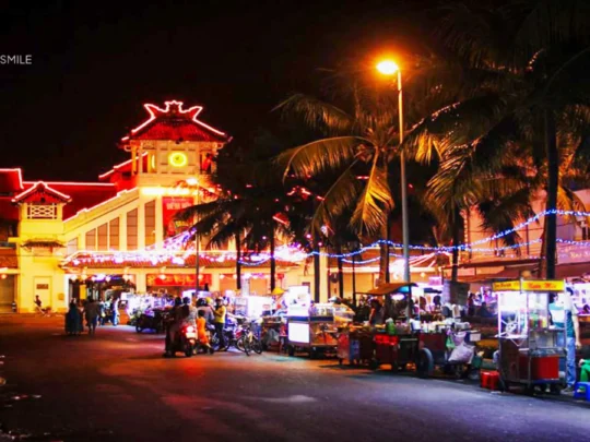 A view of people strolling around the bustling Ninh Kieu night market, a popular evening destination