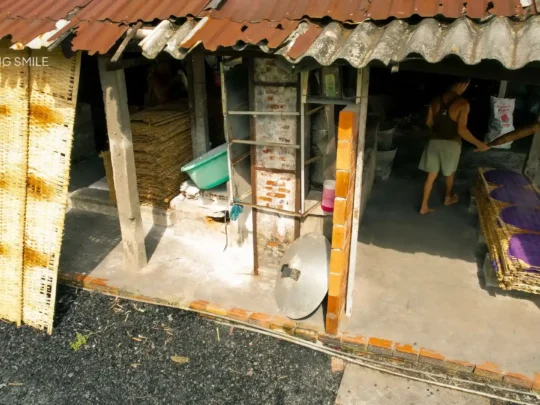Visiting a traditional rice noodle workshop to see how local food is made during our tour in Can Tho