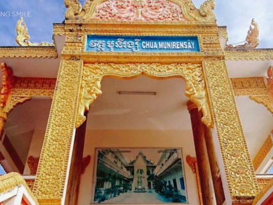 A close-up of the characteristic Khmer architecture of Munir Khsay Pagoda, with detailed carvings and ornate designs.