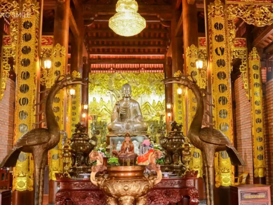 A solemn and serene worship area inside a temple, showing a reverence for tradition and faith.