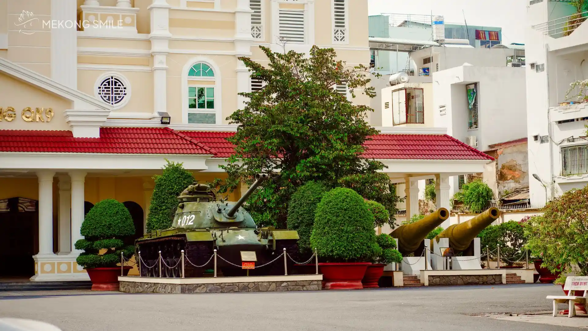 A war-era tank parked in front of the Military Zone 9 Museum, a poignant reminder of the past.