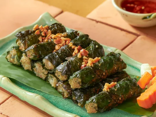 A platter of vegetarian "Bo La Lot" made with plant-based ingredients wrapped in fragrant wild betel leaves