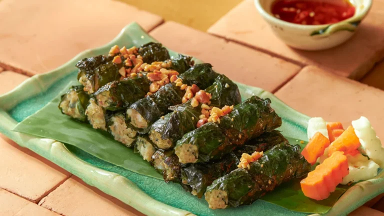 A platter of vegetarian "Bo La Lot" made with plant-based ingredients wrapped in fragrant wild betel leaves