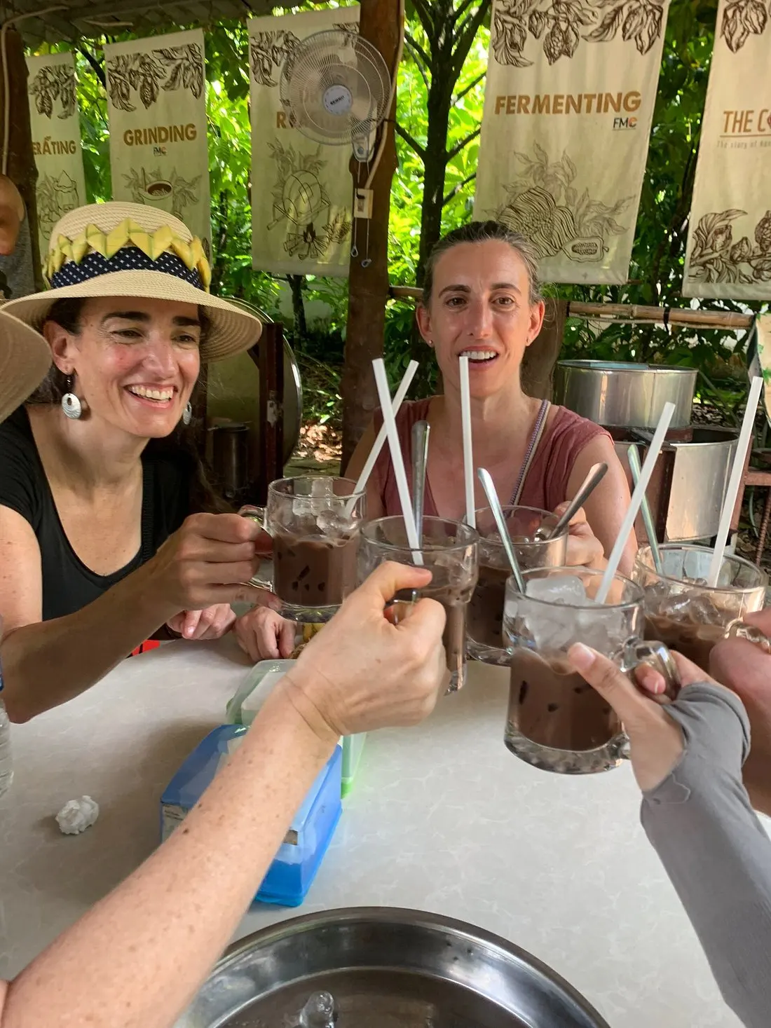 Tourists try to drink vietnamese coffee
