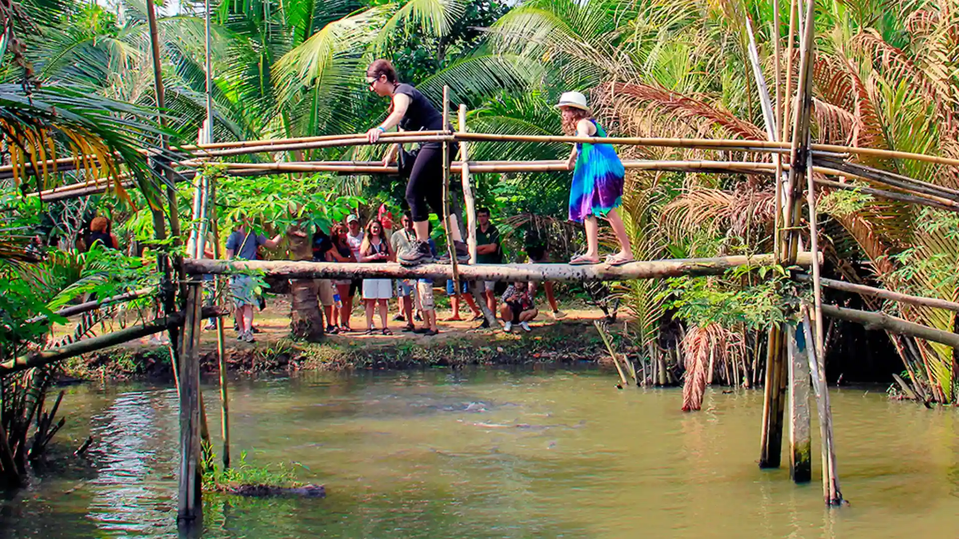Cau Khi bamboo bridge crossing at Can Tho Fruit Garden – fun and authentic rural experience