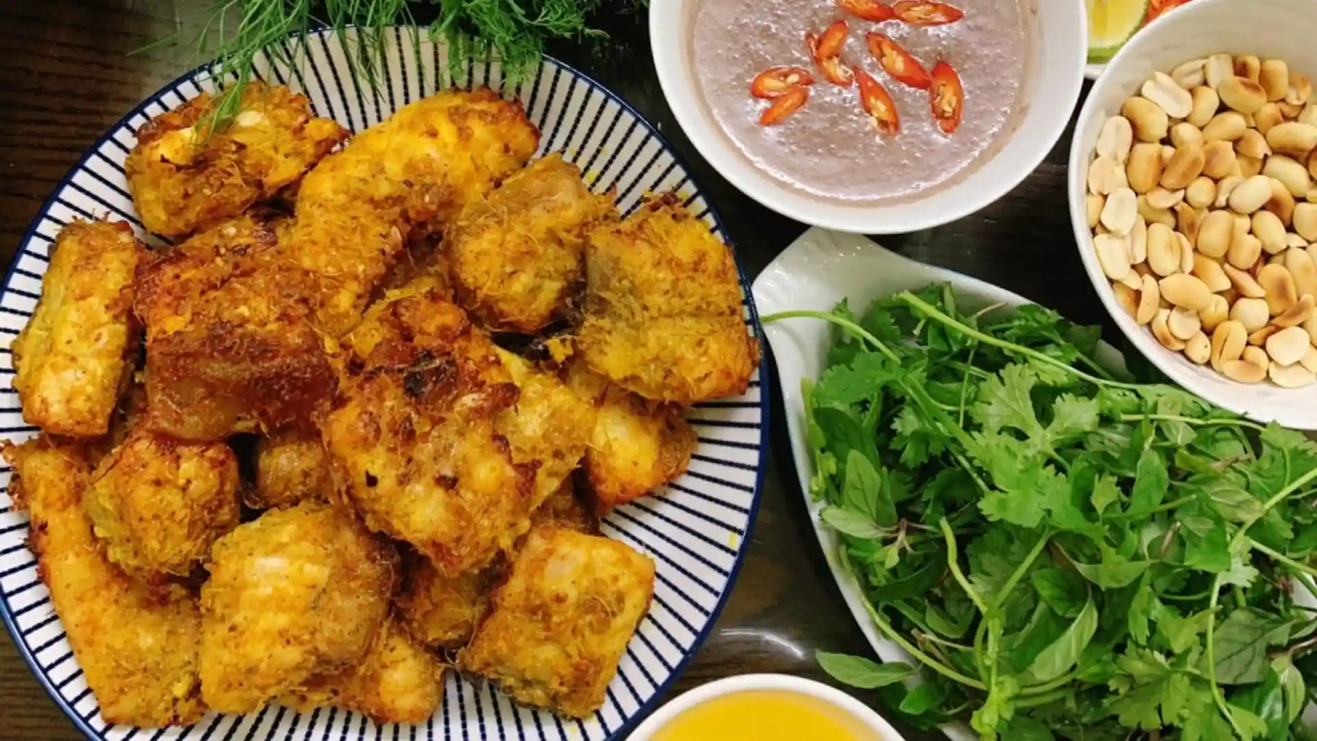 What to Eat in Vietnam: 30 Must-Try Dishes 82 Turmeric-seasoned Hanoi-style fish served with herbs and dipping sauce
