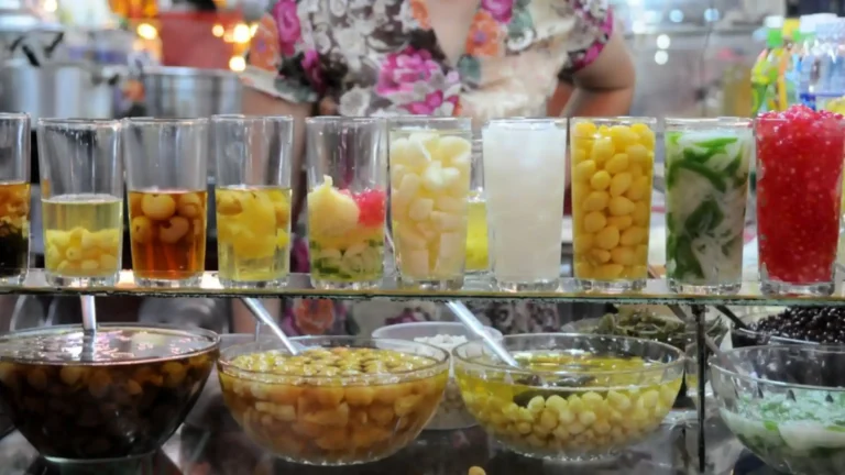 Assorted Vietnamese chè desserts displayed in glasses and bowls