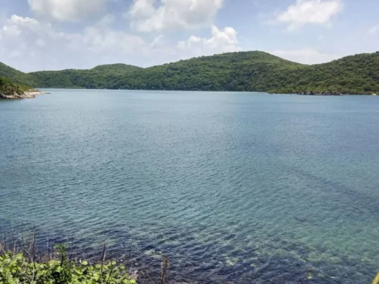 Clear water and green hills at Bamboo Lagoon during the Con Dao forest and sea tour