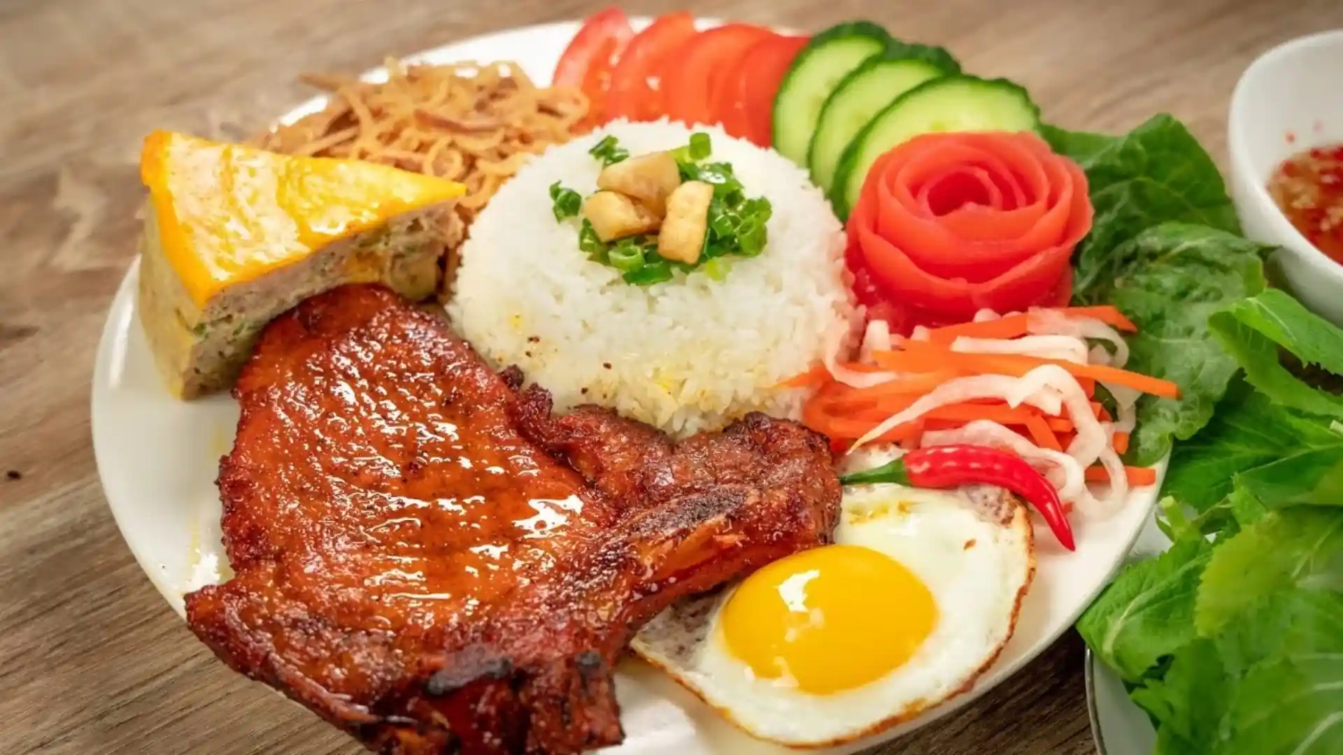 What to Eat in Vietnam: 30 Must-Try Dishes 93 Vietnamese cơm tấm broken rice with grilled pork chop and fried egg