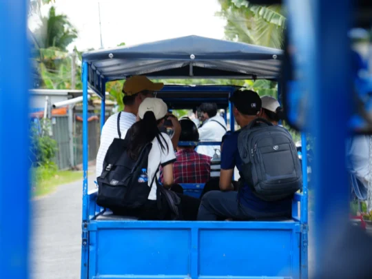 Electric car ride through peaceful village roads in the Mekong Delta countryside