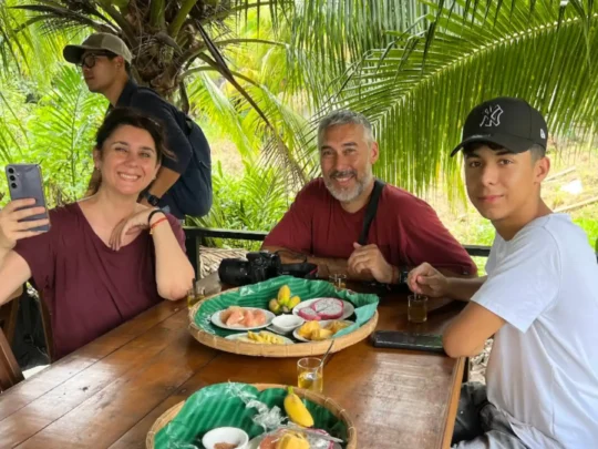Guests enjoying local food during the Ben Tre tour