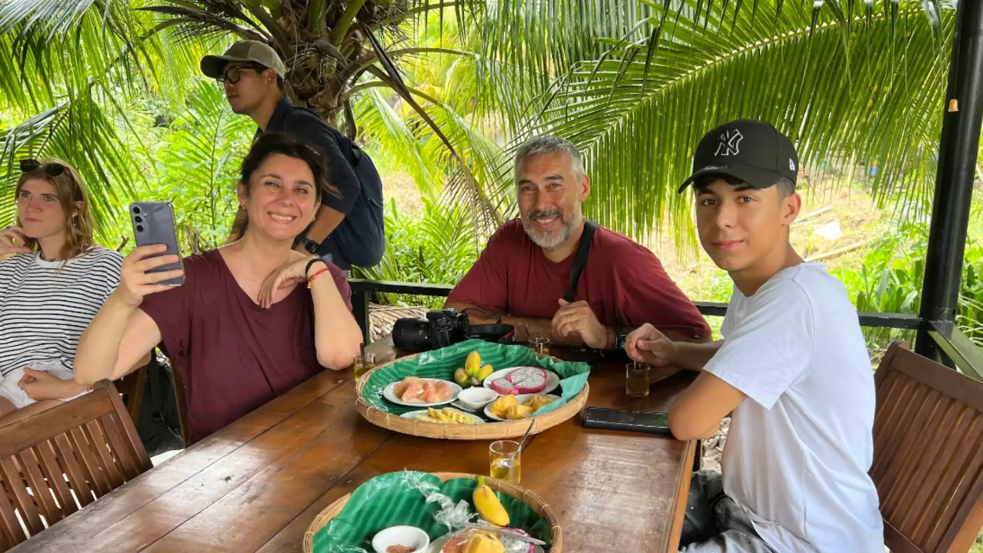 Guests enjoying local food during the Ben Tre tour