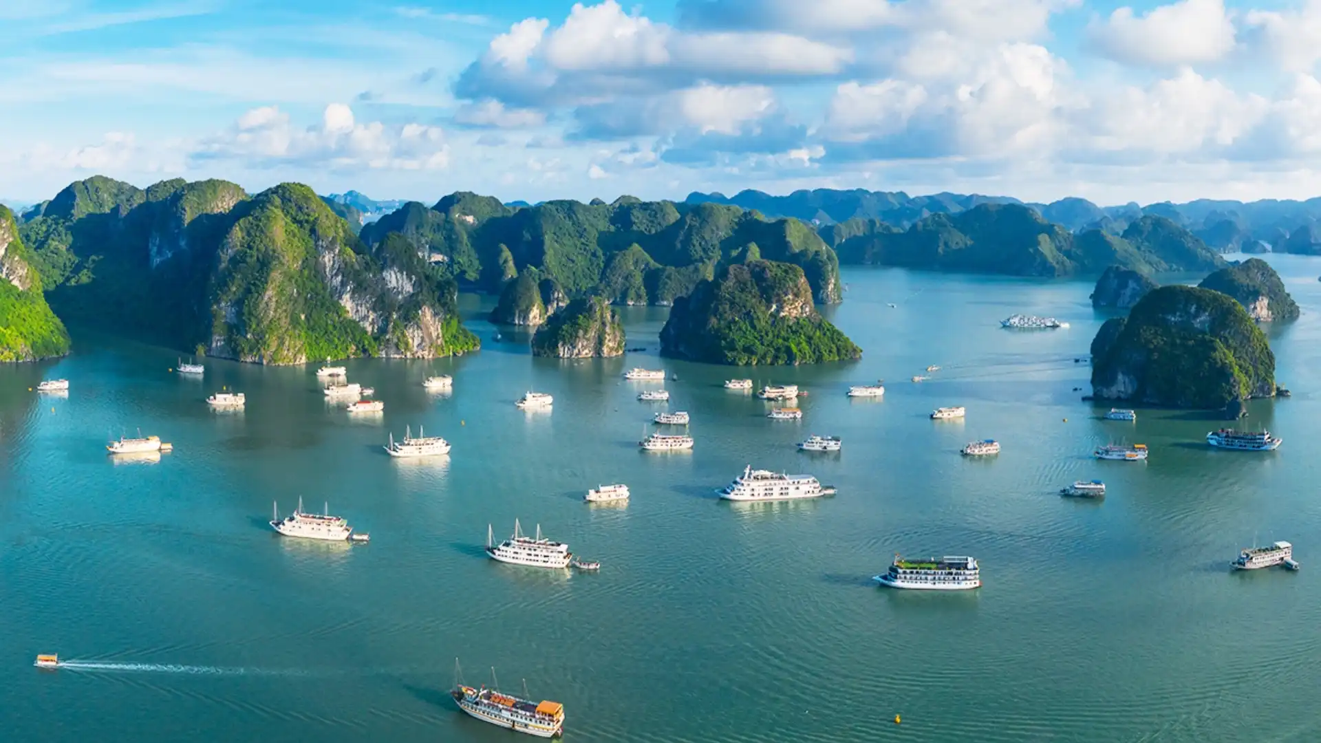 Vietnam Travel Guide for First-Time Visitors 16 Limestone islands and cruise boats in Ha Long Bay, Vietnam