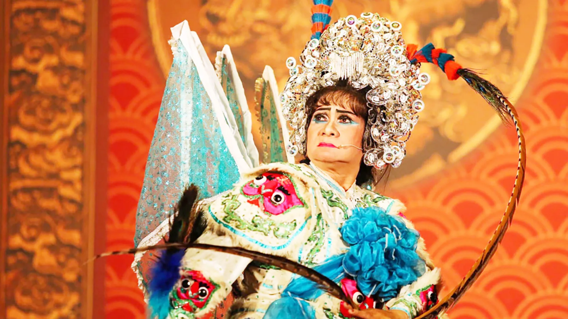 Actors performing traditional Hat Boi in colorful costumes