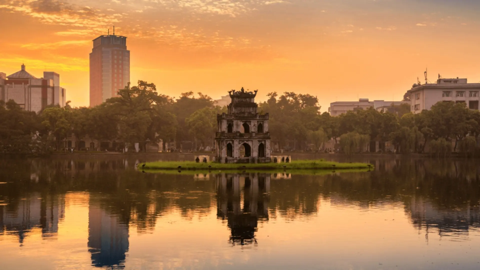 Vietnam Travel Guide for First-Time Visitors 15 Turtle Tower on Hoan Kiem Lake in Hanoi at sunset
