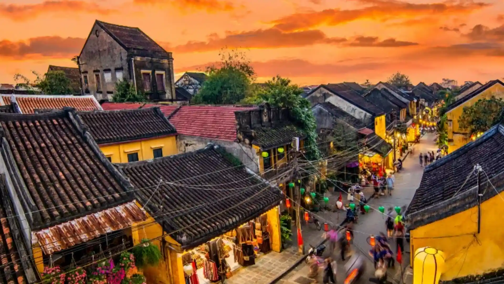 Vietnam Travel Guide for First-Time Visitors 20 Historic yellow buildings and tiled rooftops in Hoi An Ancient Town at sunset