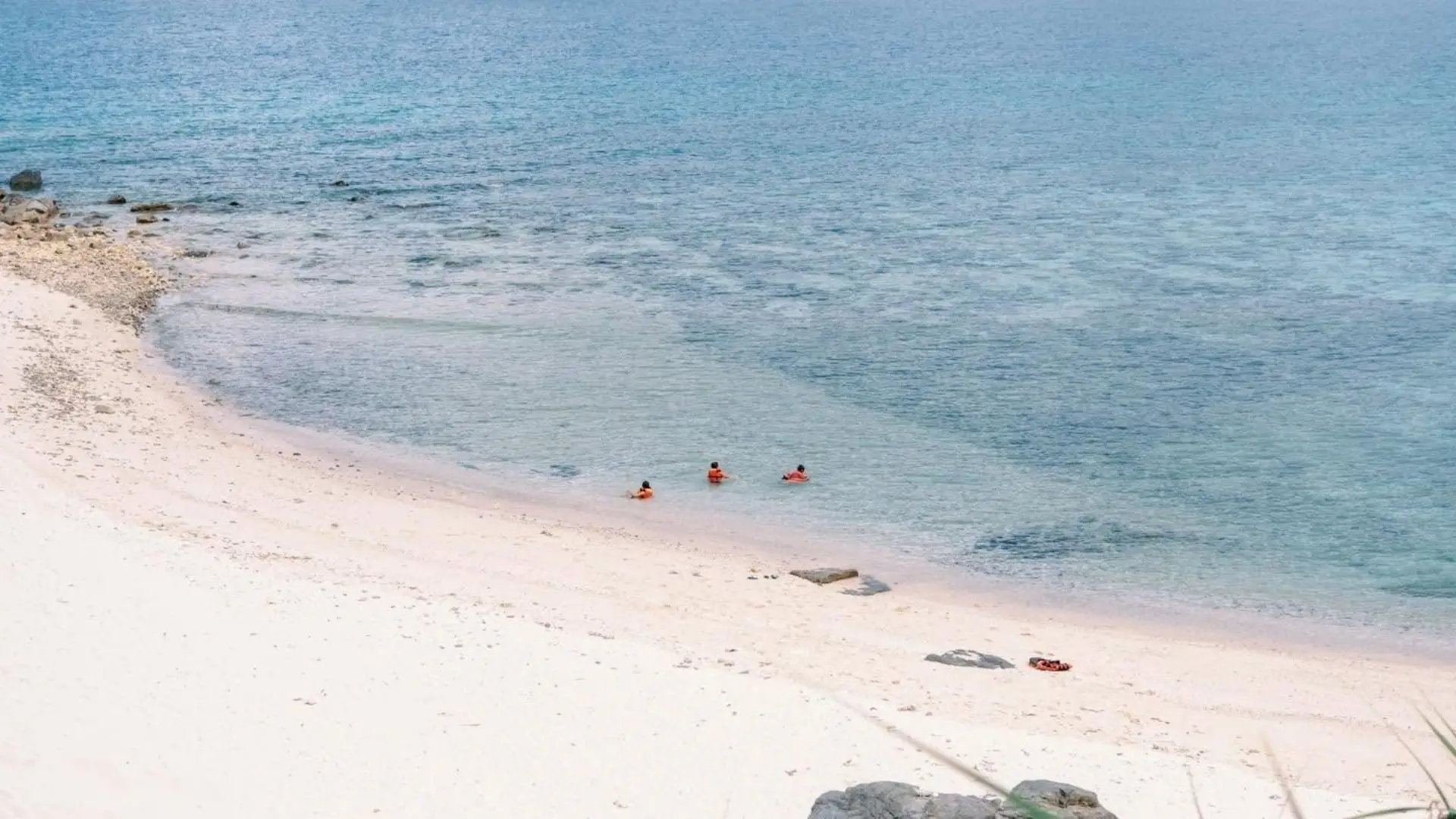 Sandy beach and clear blue water on Hon Tai Island in Con Dao