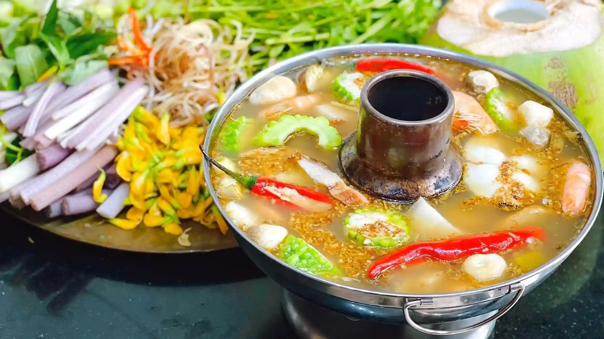 What to Eat in Vietnam: 30 Must-Try Dishes 102 Mekong Delta lẩu mắm hotpot served with fish and vegetables