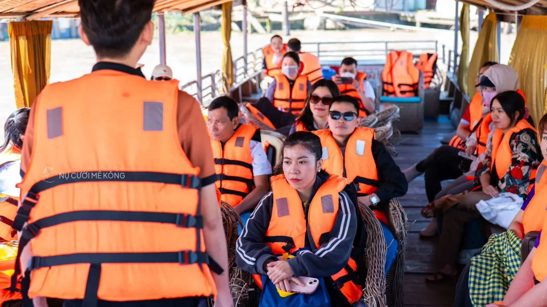 International famtrip group experiences river tourism on a boat in Can Tho with Mekong Smile
