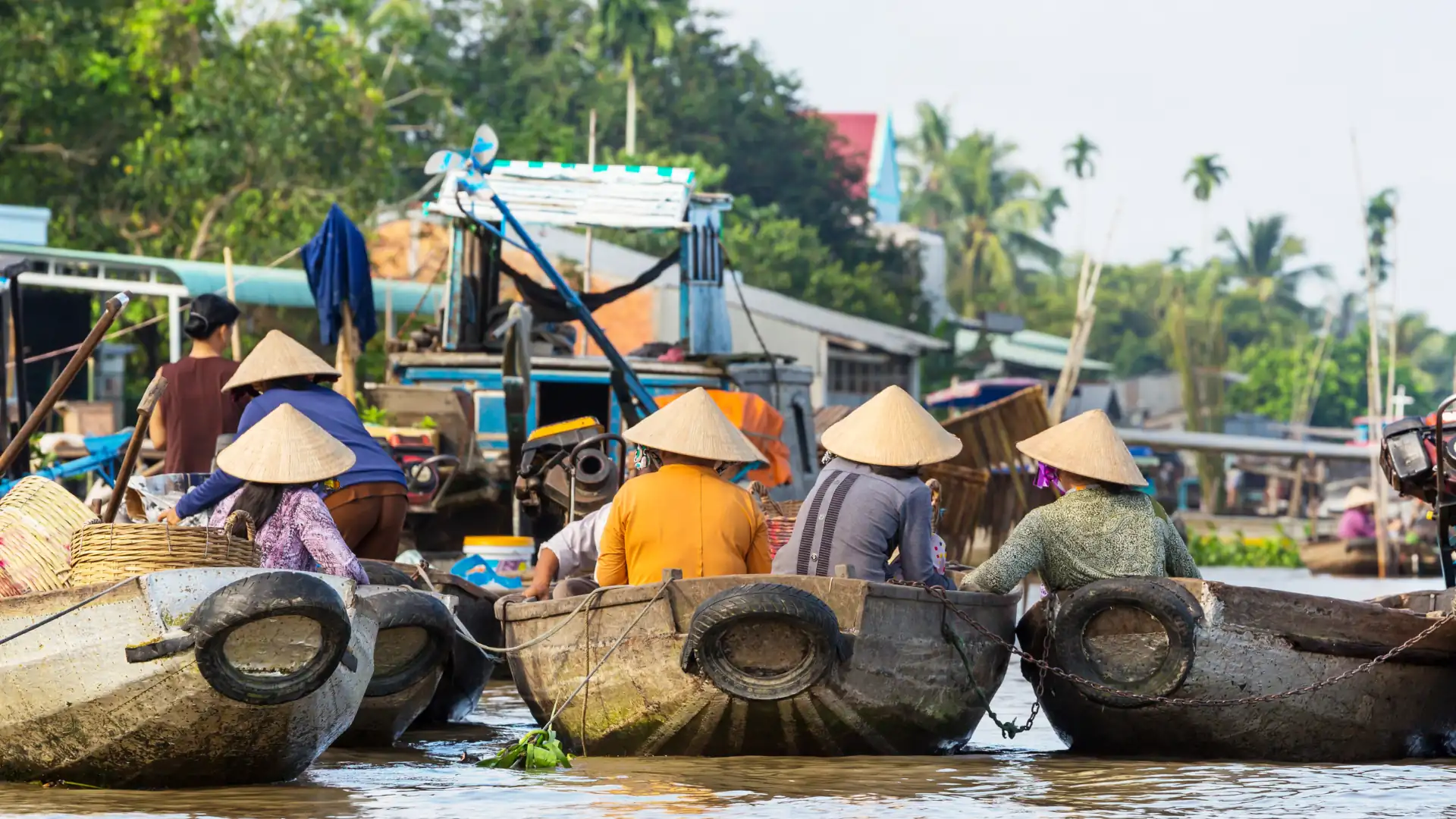 Locals adapting to floating homes and boats along the Mekong River