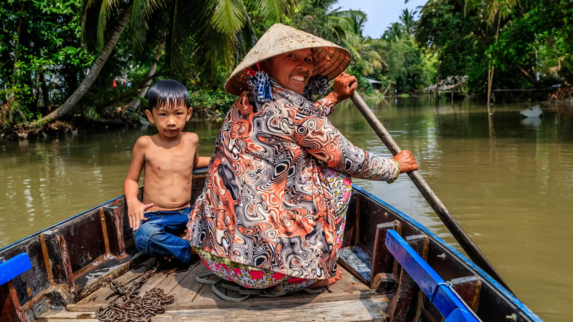 Farmers working on fertile rice fields symbolizing early Mekong pioneers