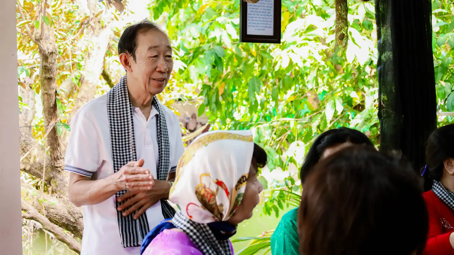 Mekong family welcoming guests to share a traditional meal