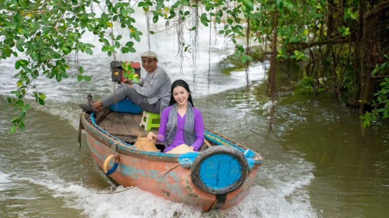 Visitors taking a boat tour through the waterways at Bang Lang Stork Garden in Can Tho