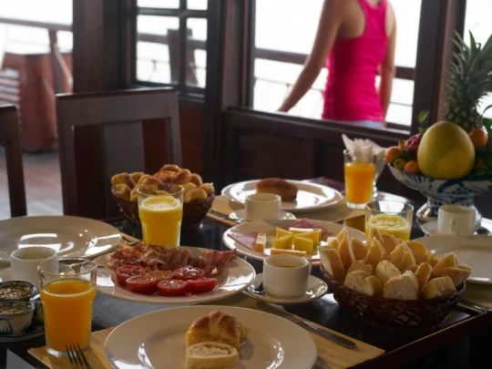 Mekong Smile Bassac Cruise Cai Be Can Tho breakfast served onboard with Mekong river view