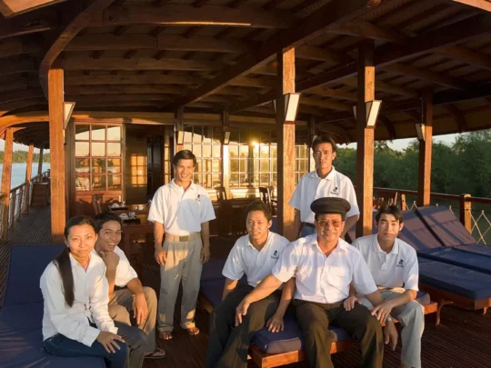 Mekong Smile Bassac Cruise Cai Be Can Tho friendly crew on sundeck