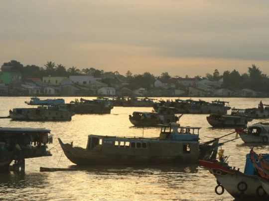 Mekong Smile Bassac Cruise Cai Be Can Tho traditional Mekong boats at sunset